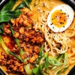 Spicy ramen with minced chicken, bok choy, green onions, and soft-boiled egg.