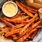 Crispy sweet potato fries with flaky salt and honey mustard dip.