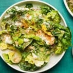 Fresh green salad with creamy yogurt ranch dressing and crispy breadcrumbs on top.