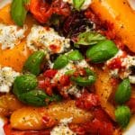 Colorful roasted peppers with mozzarella, fresh basil, and pepper.