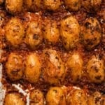 Golden crispy potatoes with melted Parmesan and herbs, baked to perfection.