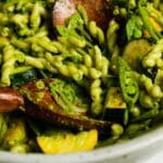 Creamy pasta salad with zucchini, snap peas, and jalapeño basil dressing.