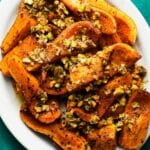 Roasted harissa squash topped with crunchy pistachios.