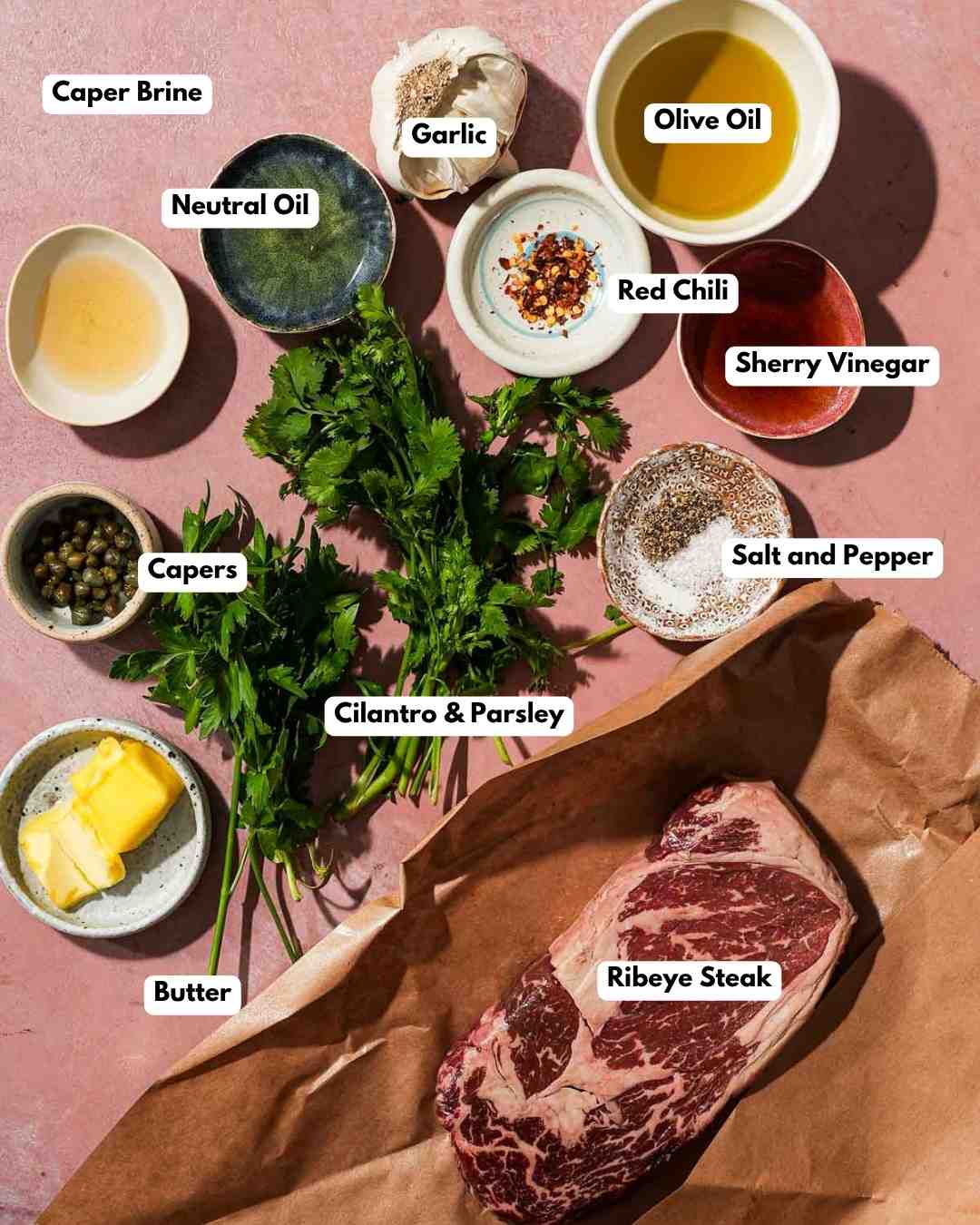 All the ingredients you need to make ribeye steak with chimichurri sauce.