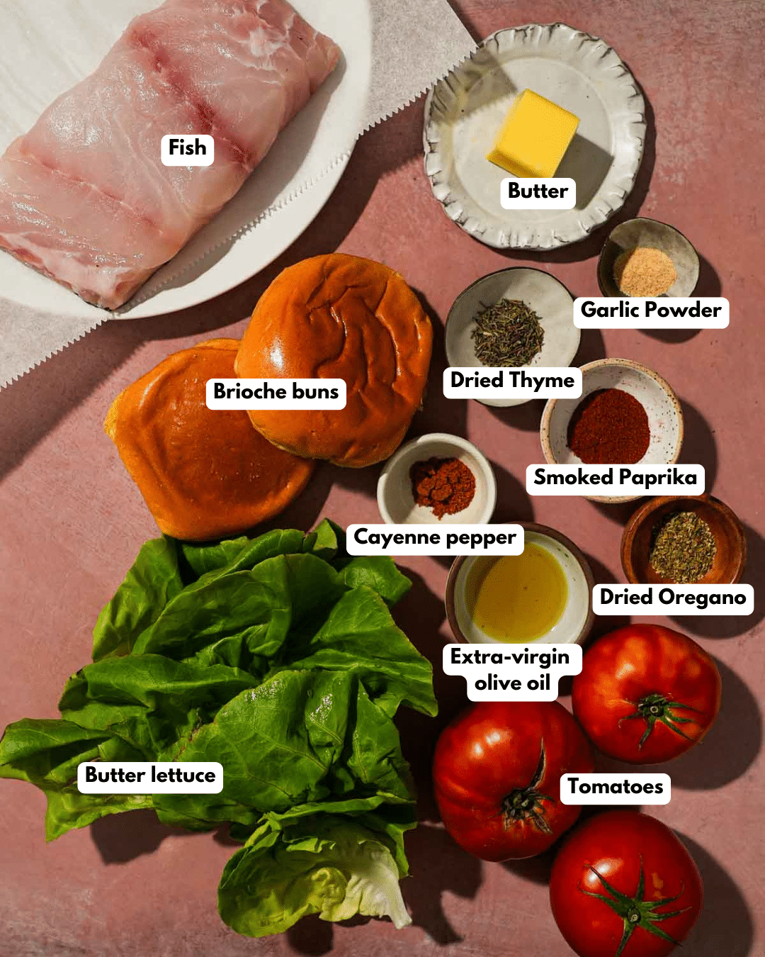 Ingredients for blackened fish sandwich including fish, buns, spices, and vegetables.