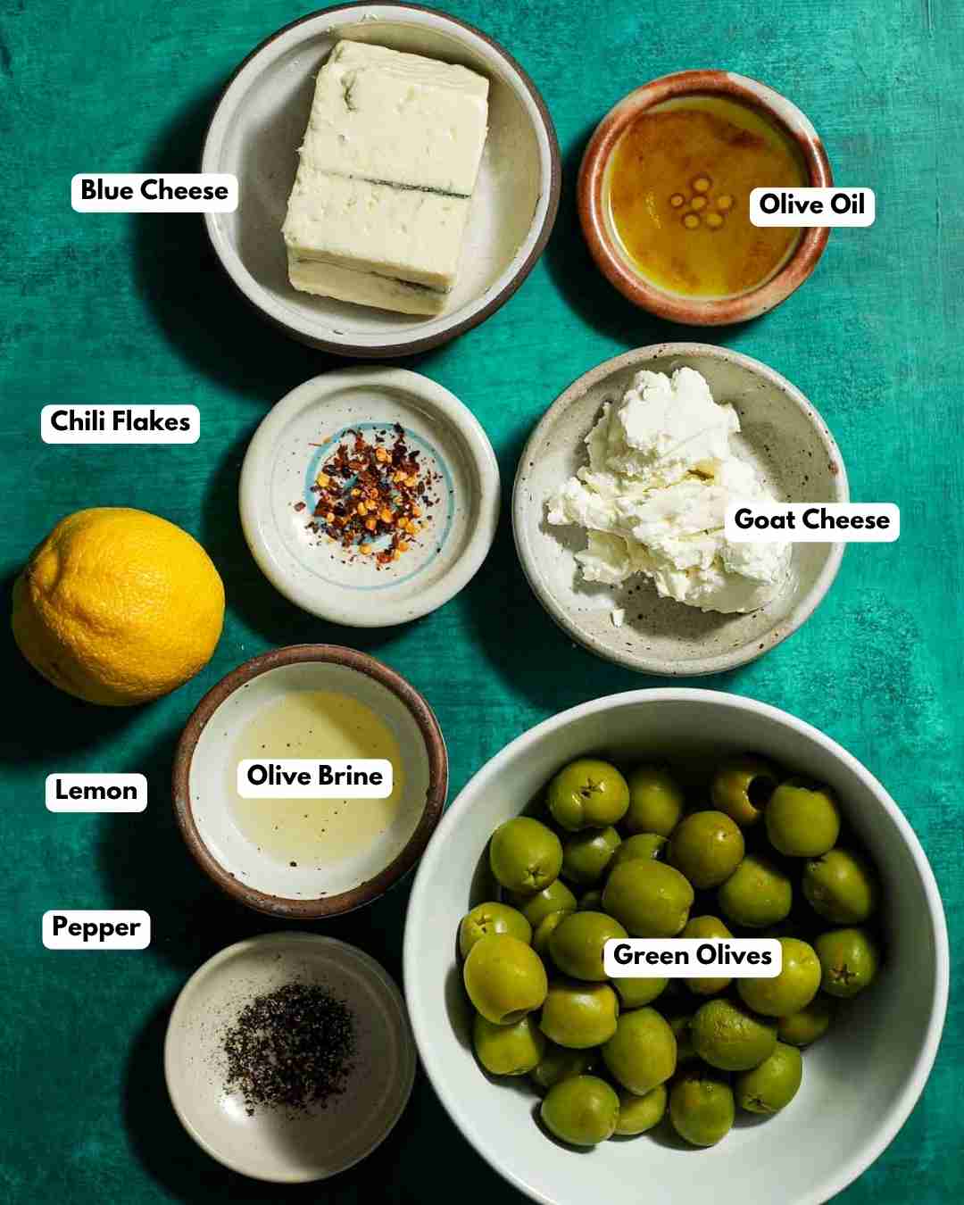 All the ingredients you need laid out for blue cheese stuffed green olives.