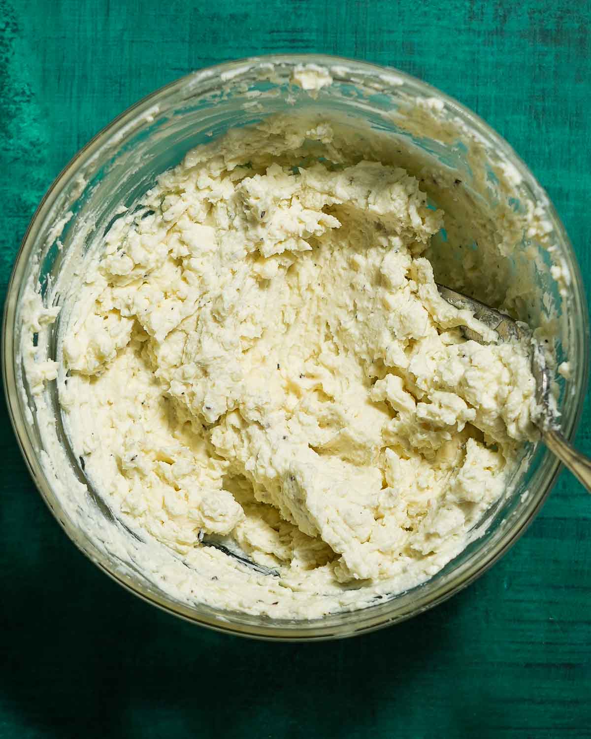 A bowl of blue cheese mixture ready to piped into green olives.