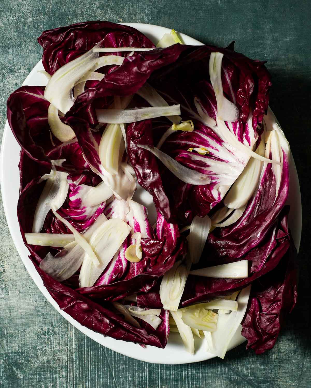 A platter of radicchio and fennel about to be topped with squash.