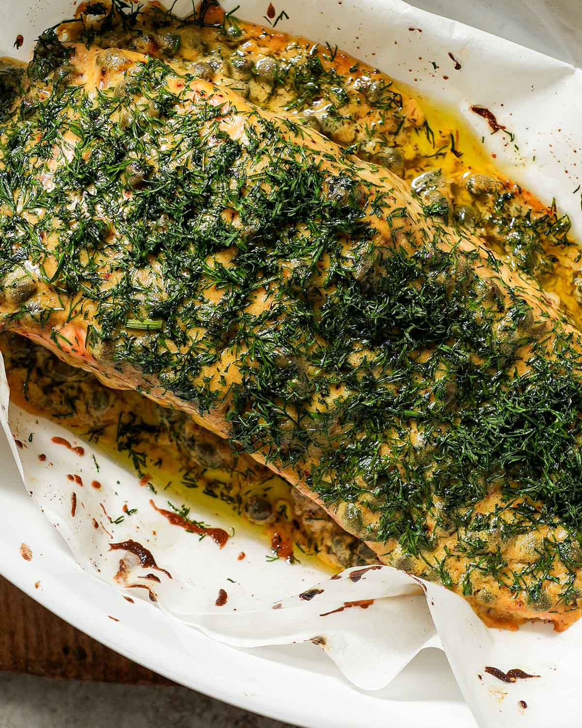 A baking dish of mustard dill salmon just out of the oven.