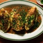 A platter of braised cabbage with miso and chives.