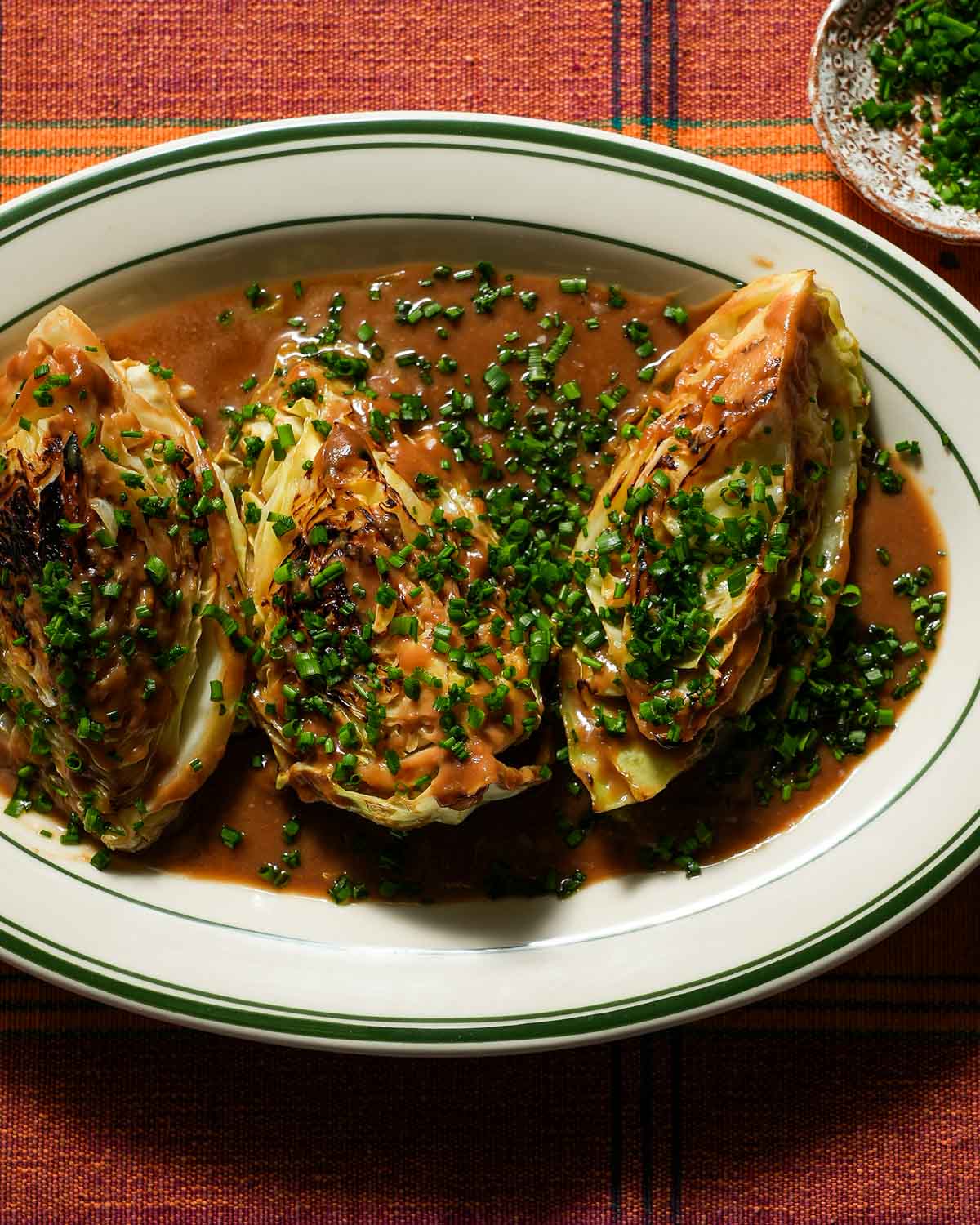 A platter of braised cabbage with miso and chives.