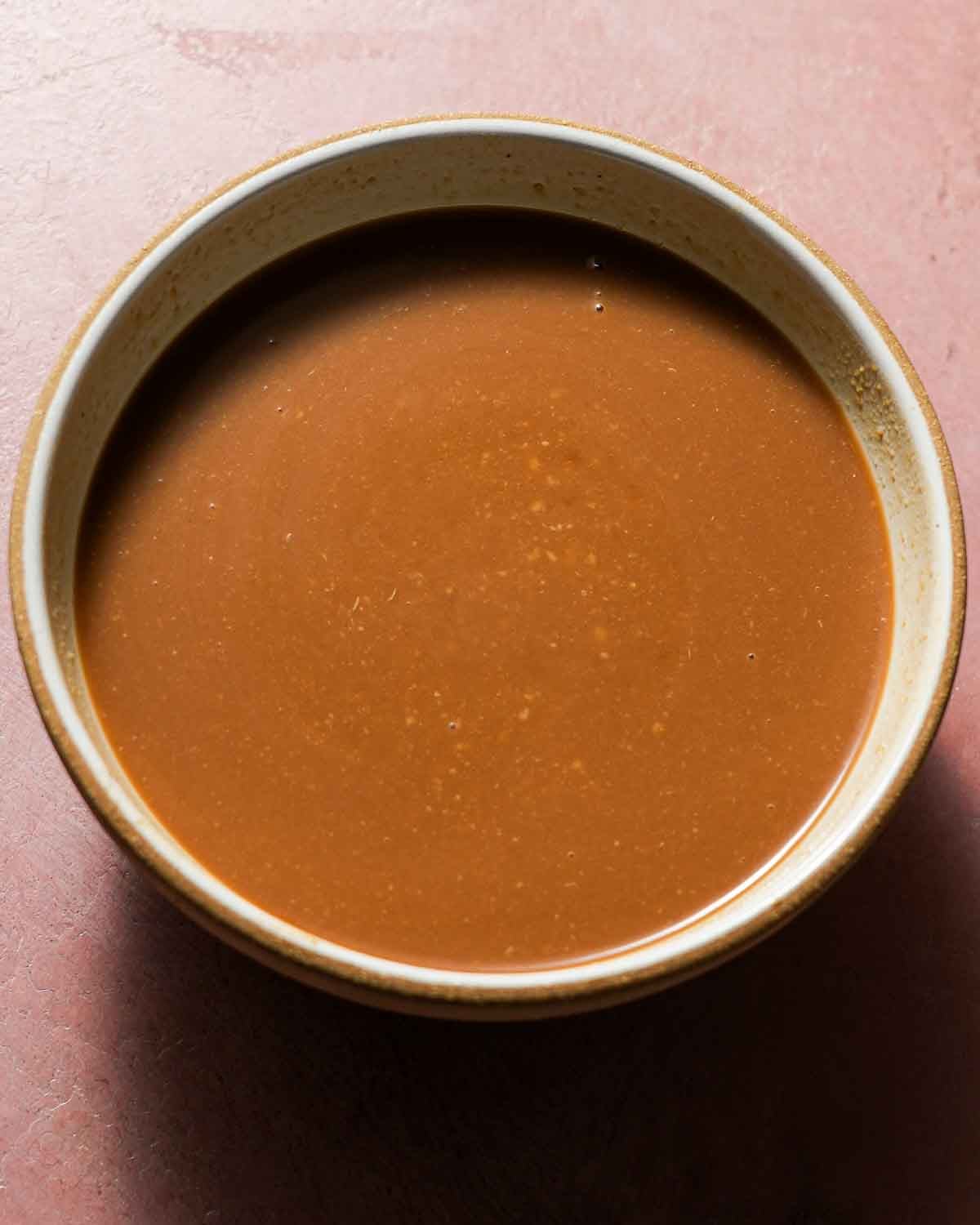 A bowl if miso sauce being ready to braised with cabbage.