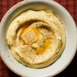 A creamy bowl of parsnip puree with a melted knob of butter.