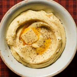 A creamy bowl of parsnip puree with a melted knob of butter.