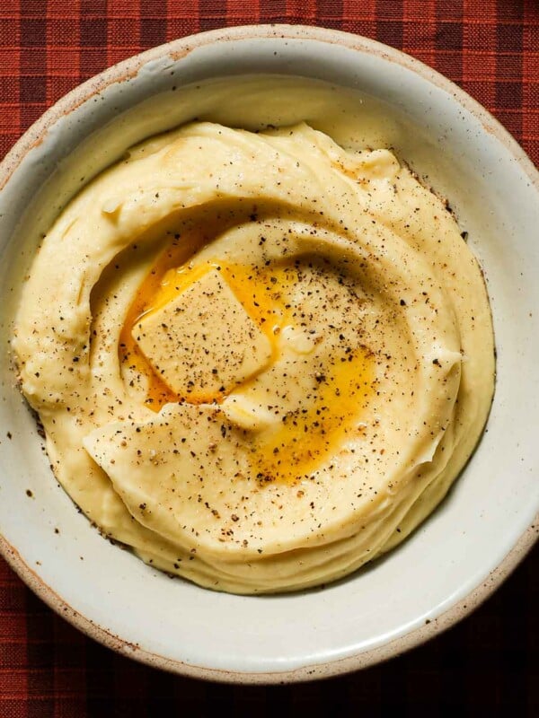 A creamy bowl of parsnip puree with a melted knob of butter.
