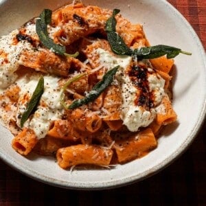 A bowl of chili crisp pumpkin rigatoni with sage.